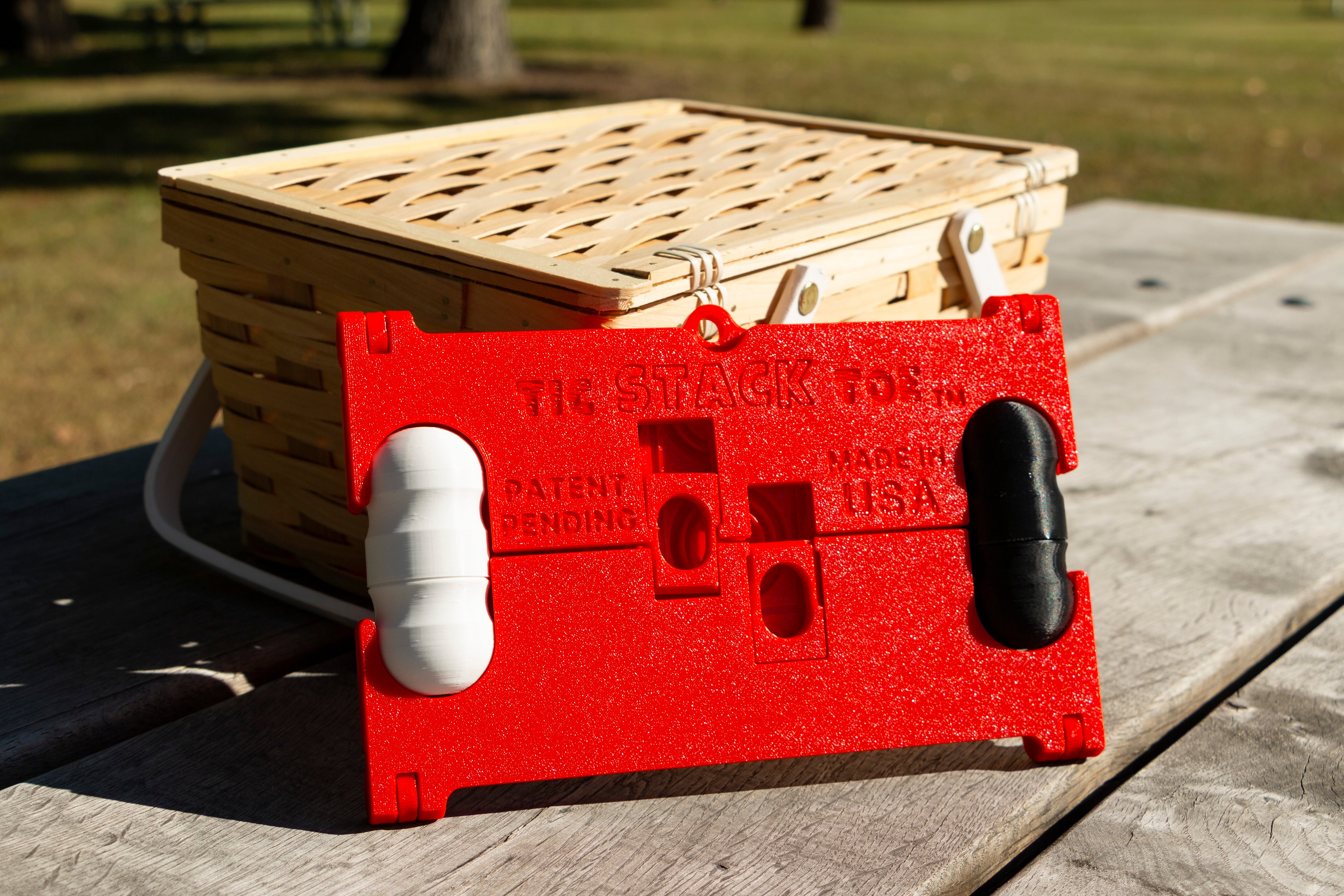 Tic STACK Toe Board leaning against picnic basket